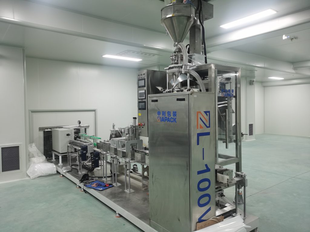 práškový vákuový baliaci stroj